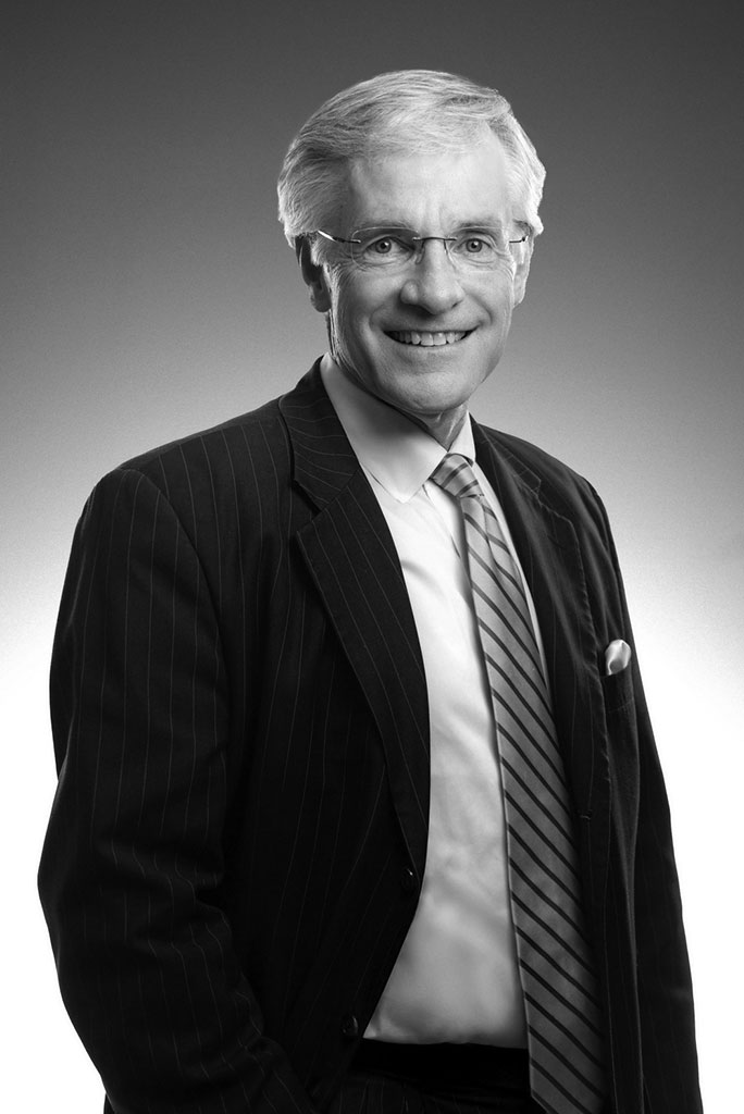 Smiling older man in suit and tie portrait