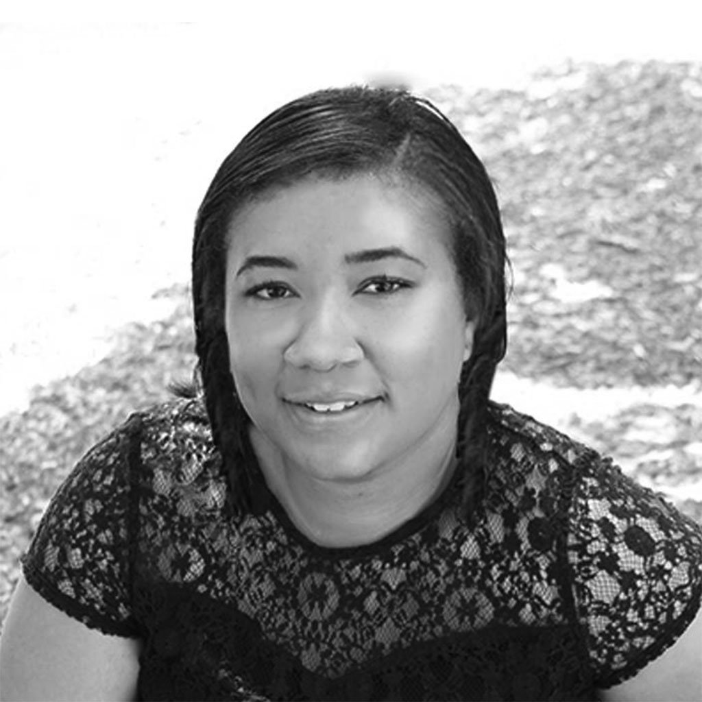 Black-and-white portrait of young woman with braids