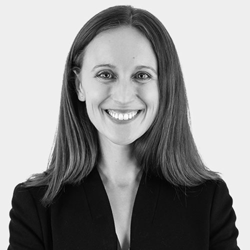 Smiling woman in black blazer portrait