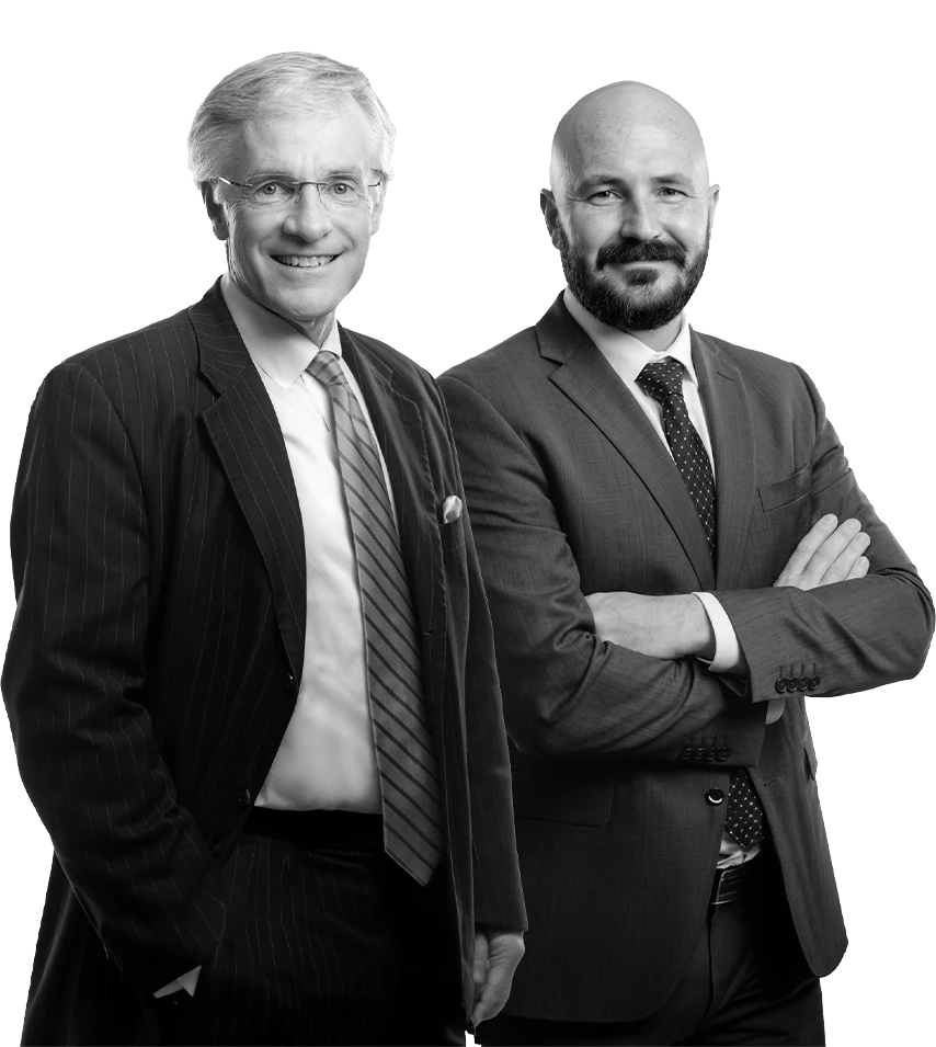 Two businessmen in suits posing confidently