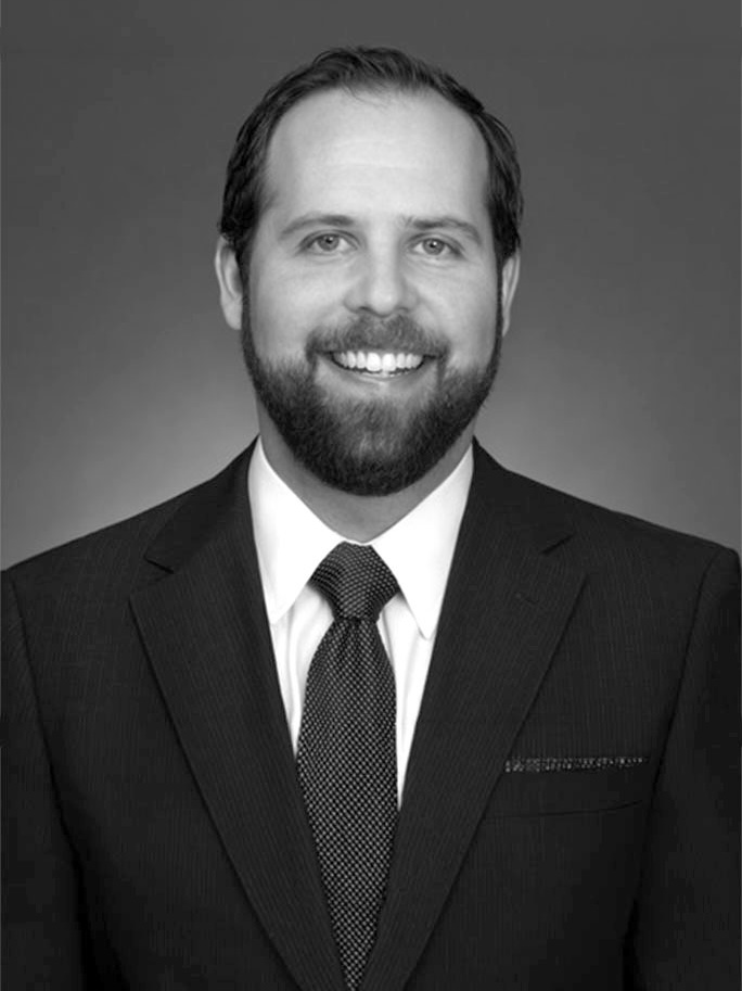 Smiling bearded man in suit and tie