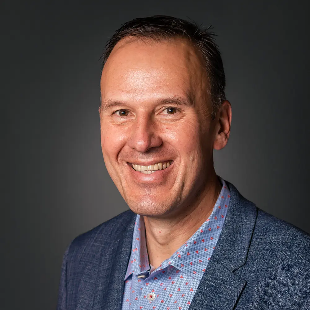 Smiling man in blue blazer portrait