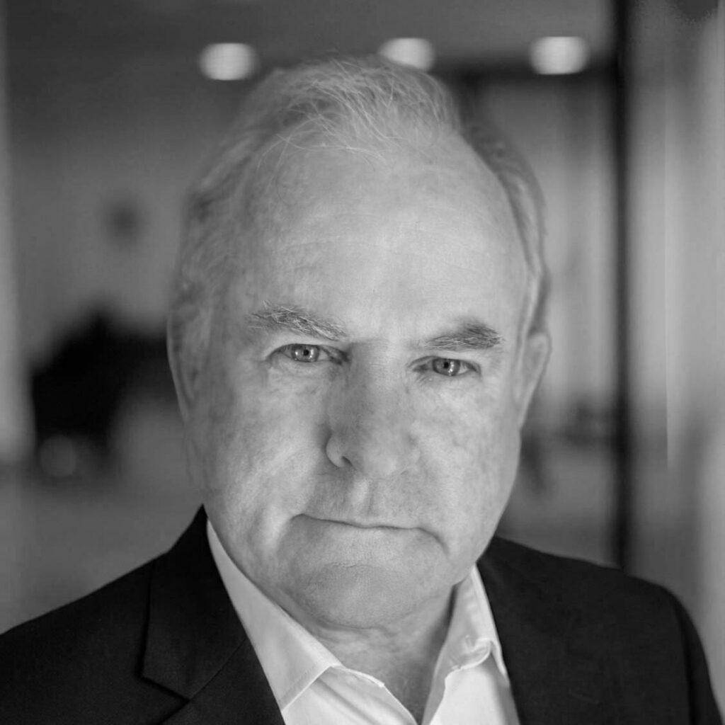 Black and white portrait of older man in suit