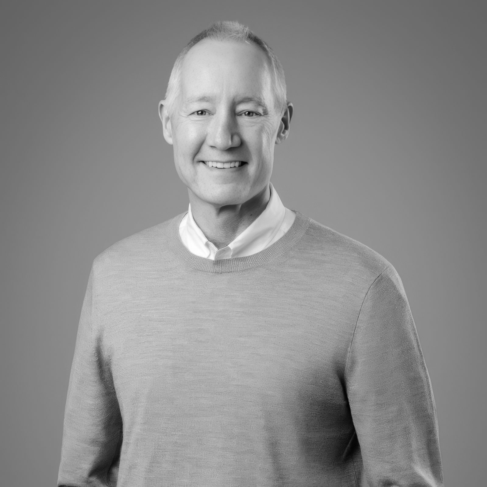 Smiling older man in sweater portrait