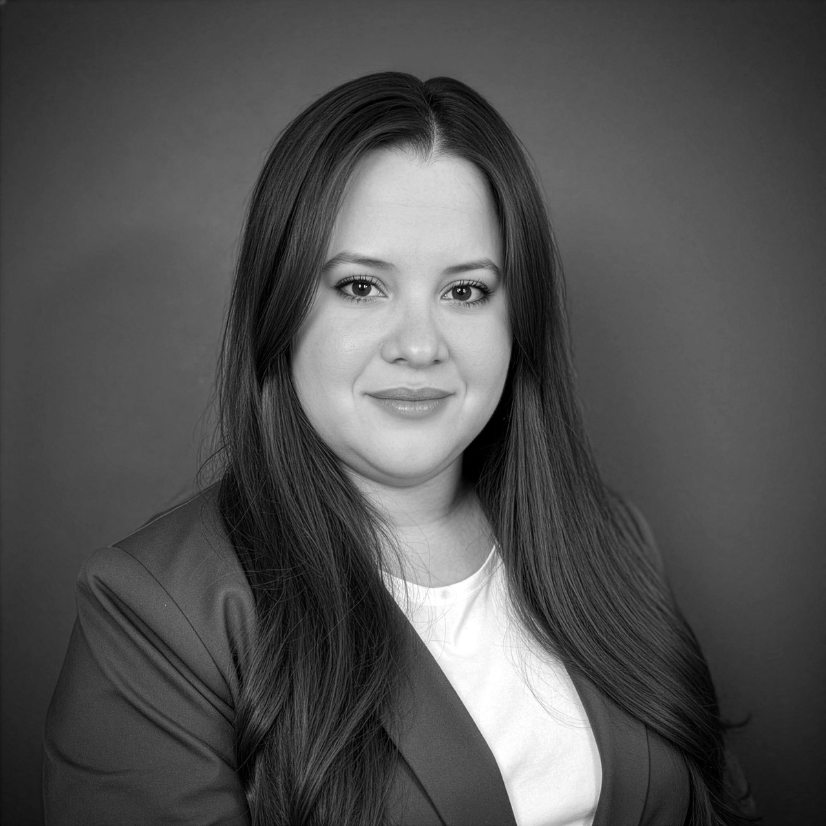 Black-and-white professional headshot of Andrea Gomez