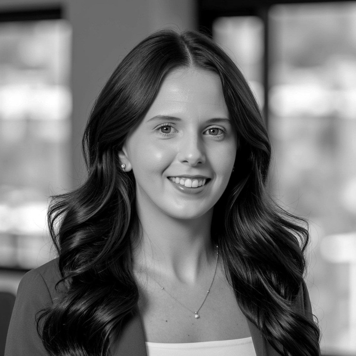 Black-and-white professional headshot of Brittany Hunsaker