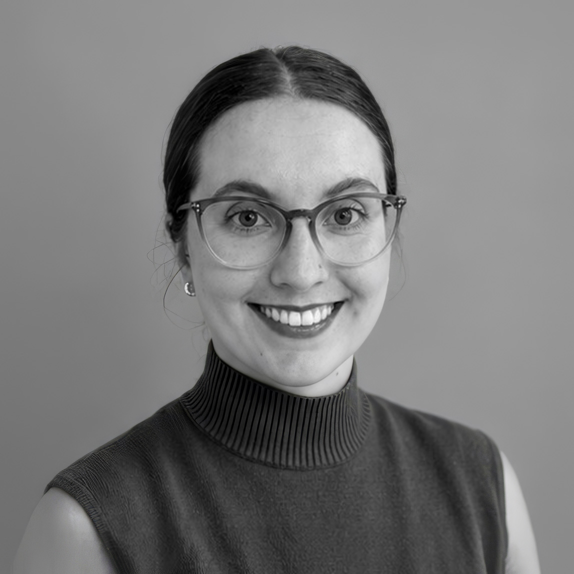 Black-and-white professional headshot of Brittany Jackson