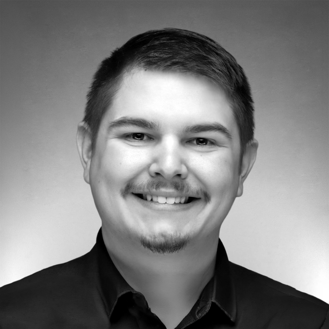 Black-and-white professional headshot of Cody Nixon
